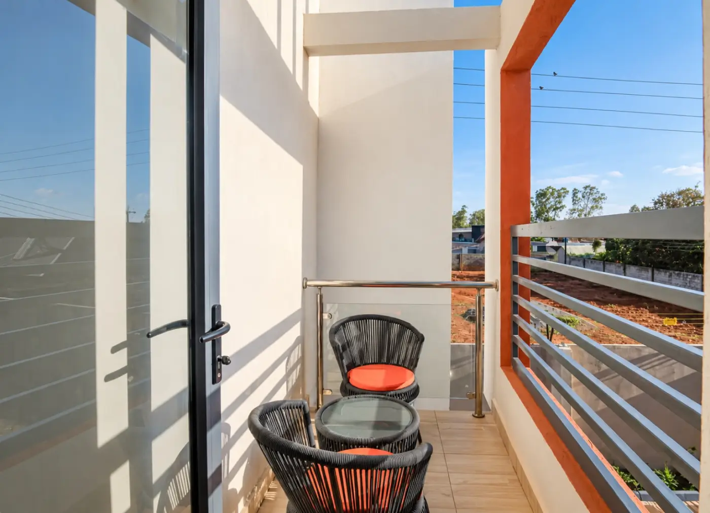 Private balcony with two chairs and a small table